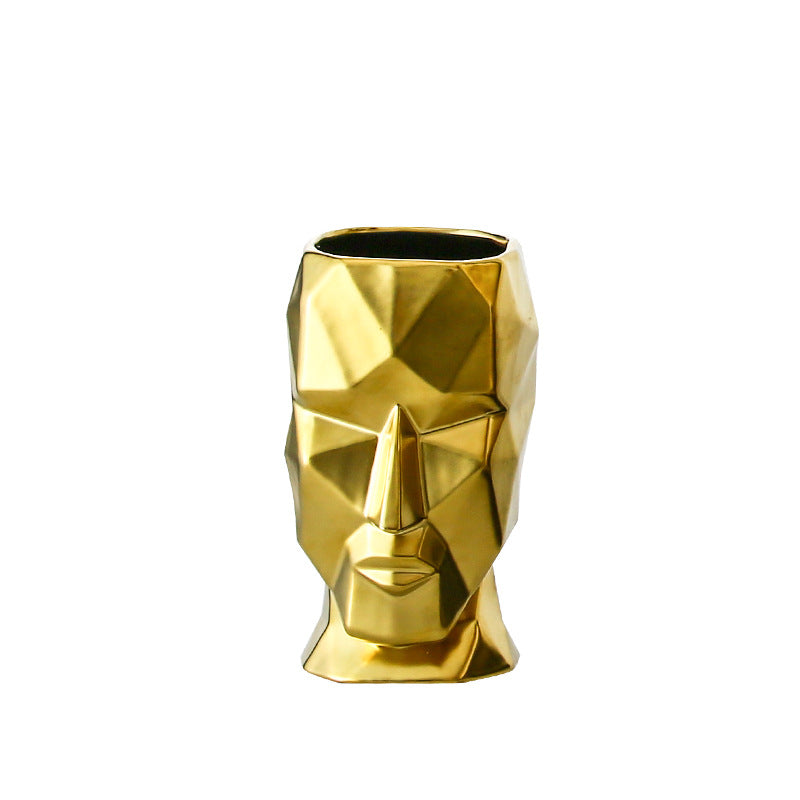 Vase visage abstrait doré