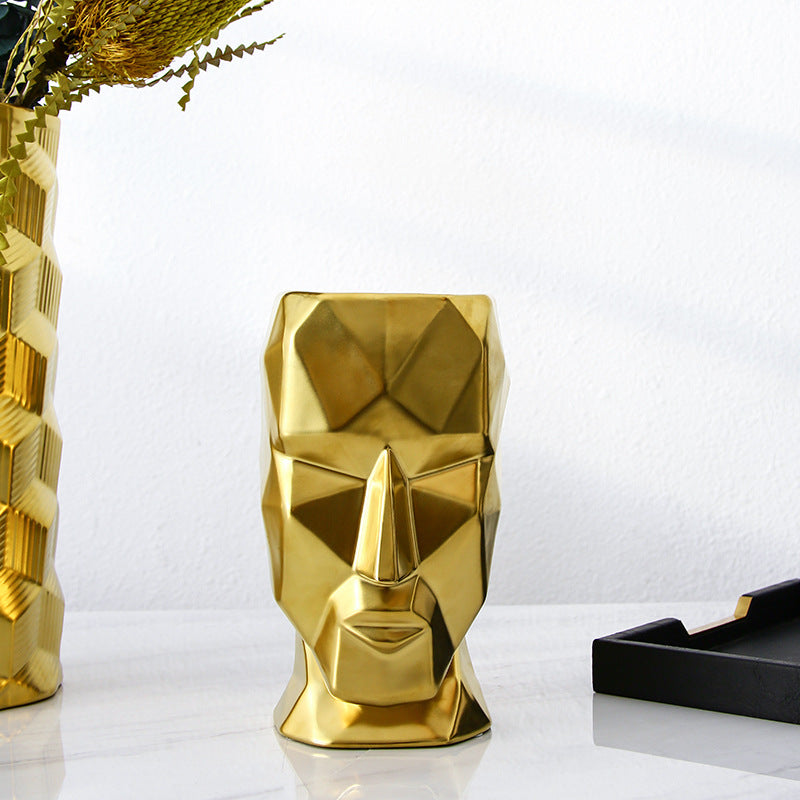 Vase visage abstrait doré